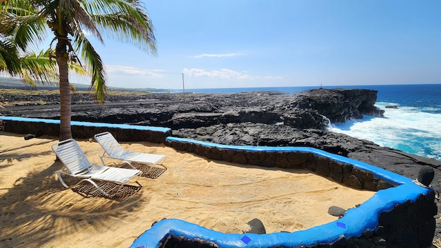 view of pool featuring a water view