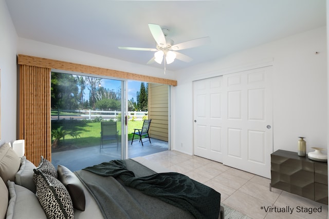 bedroom featuring access to exterior, light tile patterned floors, a closet, and ceiling fan