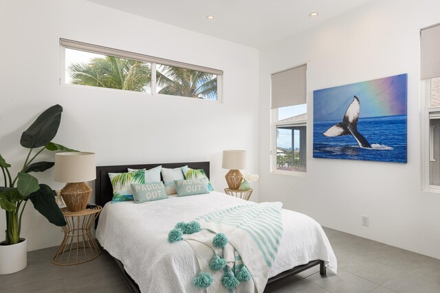 tiled bedroom with ceiling fan