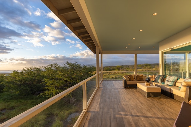 wooden terrace featuring an outdoor living space