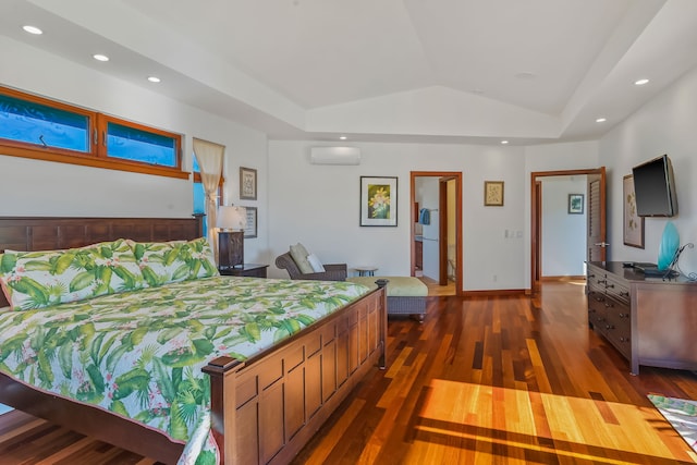 bedroom featuring dark hardwood / wood-style flooring, lofted ceiling, and a wall mounted AC