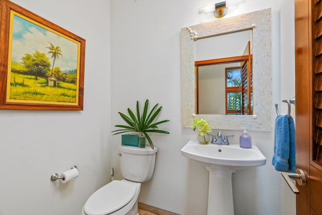 bathroom featuring toilet