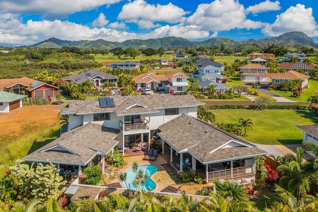 birds eye view of property with a mountain view