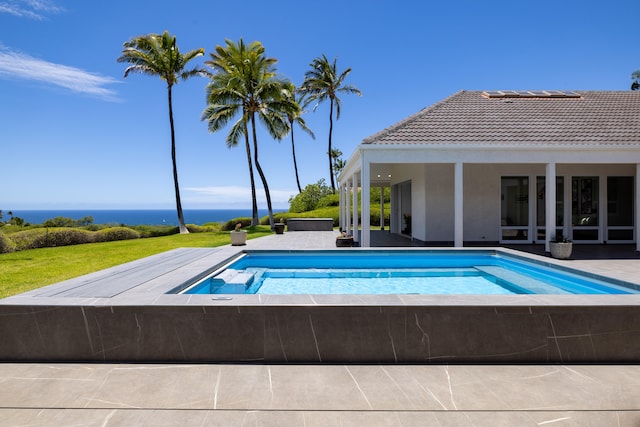 view of swimming pool featuring a water view