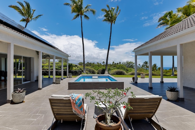 view of pool with a patio area and a jacuzzi