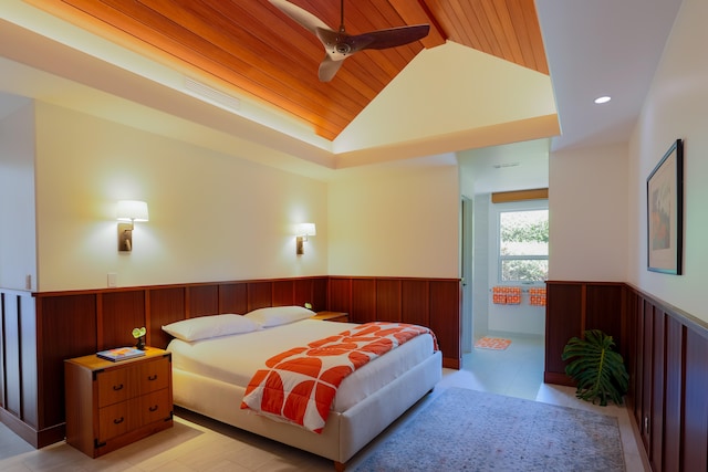 tiled bedroom featuring ceiling fan, high vaulted ceiling, and wood ceiling