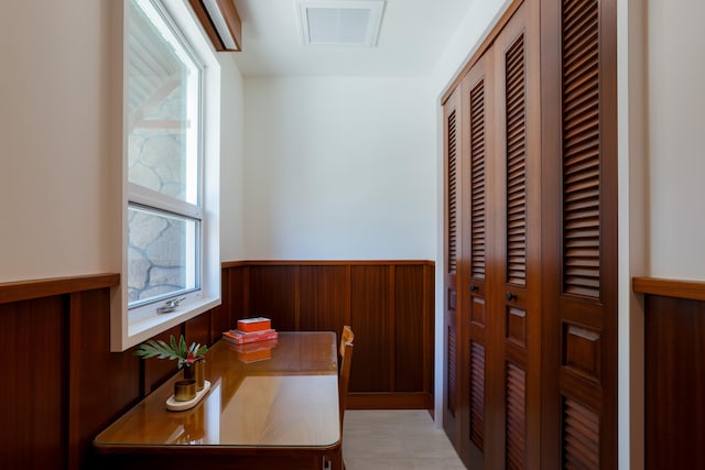 office space featuring wood walls