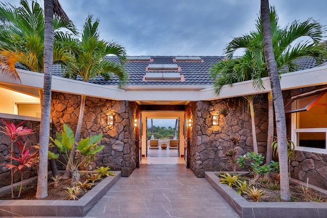 entrance to property with a patio area