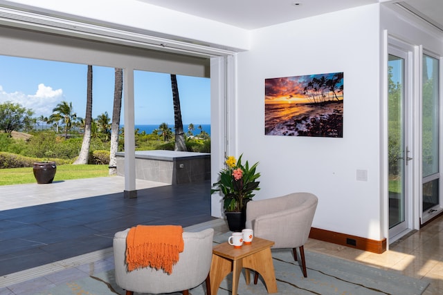 living area with a water view