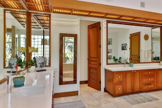 bathroom featuring tile patterned flooring and vanity