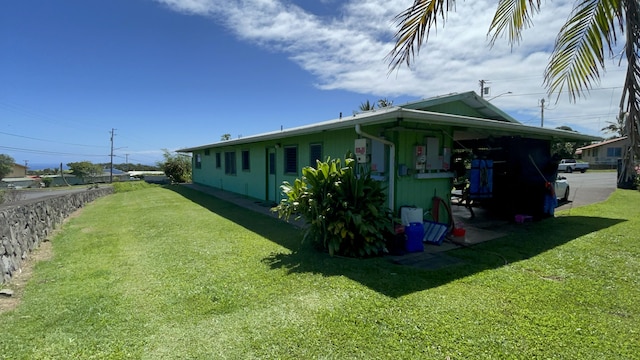 view of property exterior with a yard