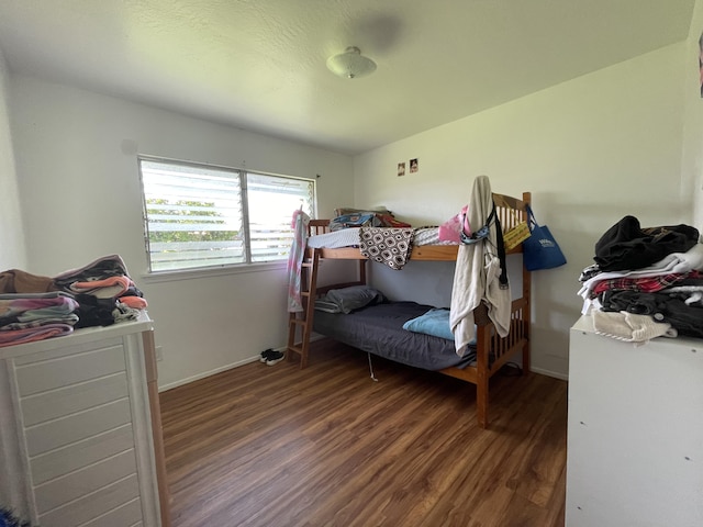 bedroom featuring dark hardwood / wood-style flooring