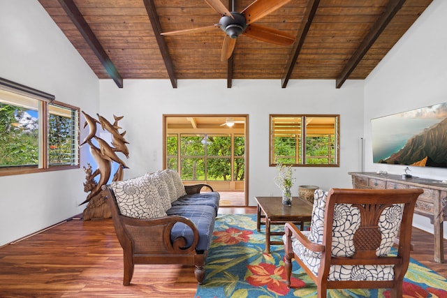 living area featuring wood-type flooring, vaulted ceiling with beams, wooden ceiling, and a healthy amount of sunlight