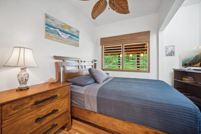 bedroom with ceiling fan and hardwood / wood-style flooring