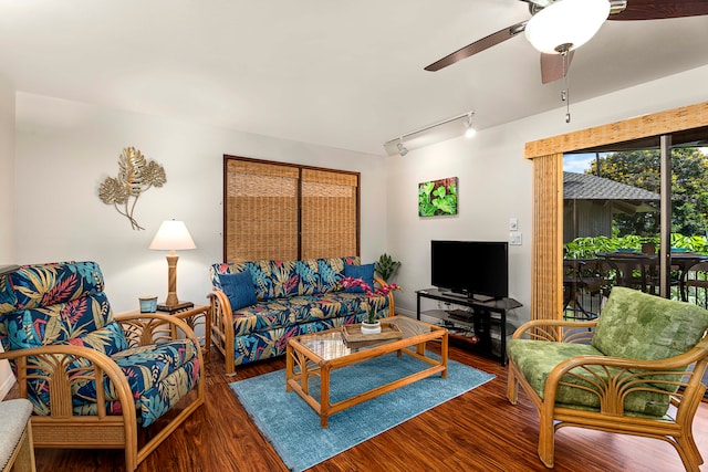 living room featuring track lighting, dark hardwood / wood-style floors, and ceiling fan