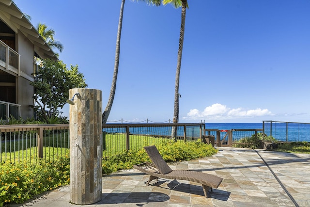 view of patio with a water view