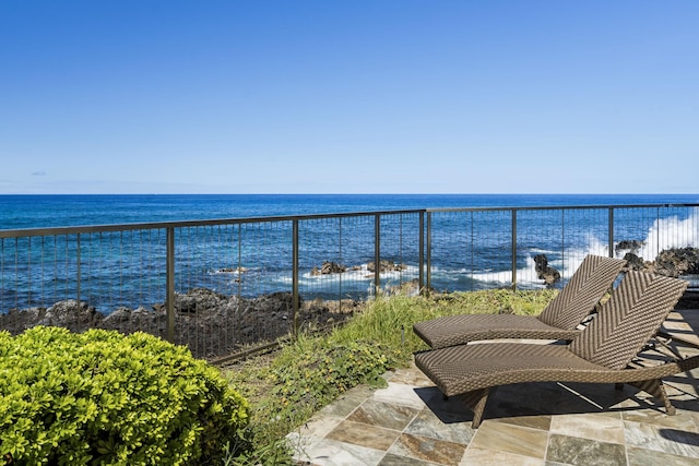 balcony featuring a water view