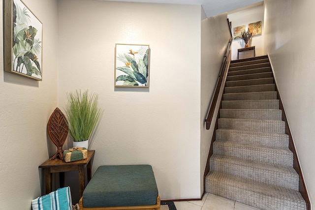 stairs featuring tile patterned floors