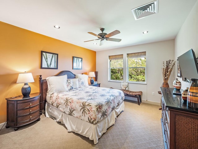 bedroom with ceiling fan and light colored carpet