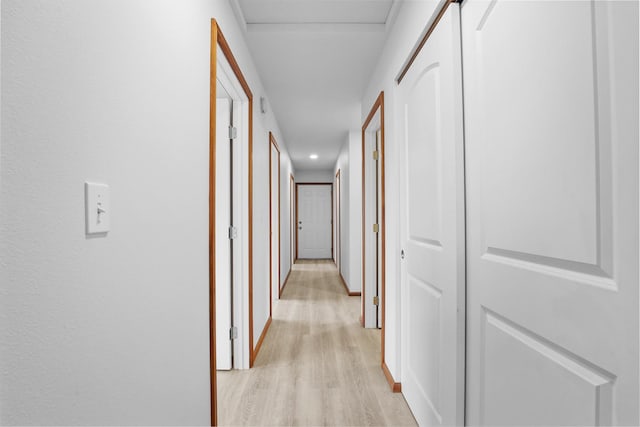 hall with light hardwood / wood-style flooring