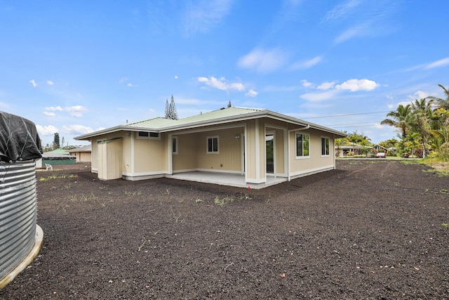 rear view of house featuring a patio