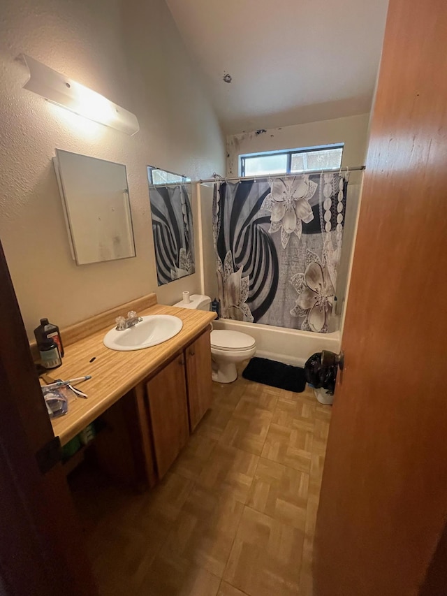 full bathroom with parquet floors, lofted ceiling, toilet, vanity, and shower / tub combo