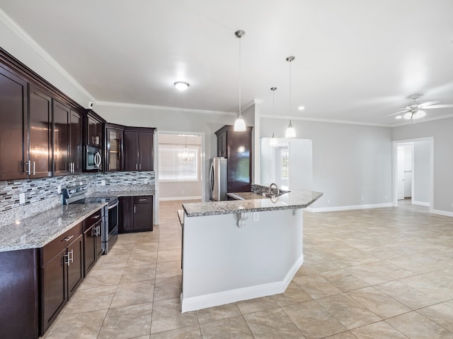 kitchen with ceiling fan, tasteful backsplash, dark brown cabinets, appliances with stainless steel finishes, and light tile floors