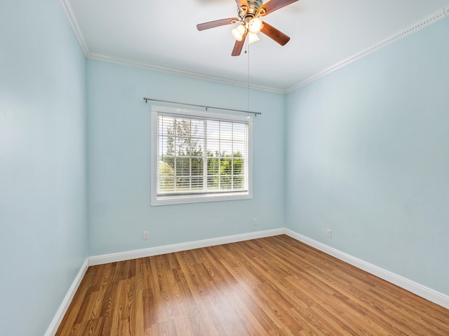 unfurnished room featuring ceiling fan, crown molding, and hardwood / wood-style flooring