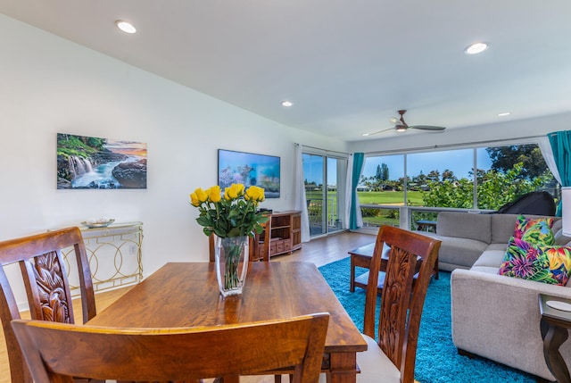 dining area featuring hardwood / wood-style floors and ceiling fan