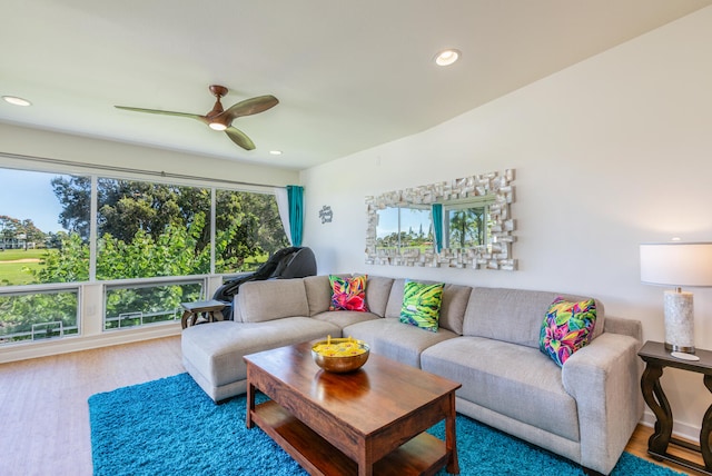 living room featuring hardwood / wood-style floors, plenty of natural light, and ceiling fan