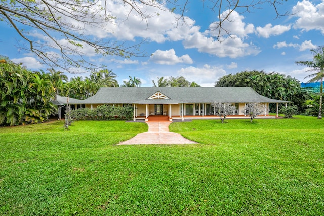 ranch-style house with covered porch and a front lawn