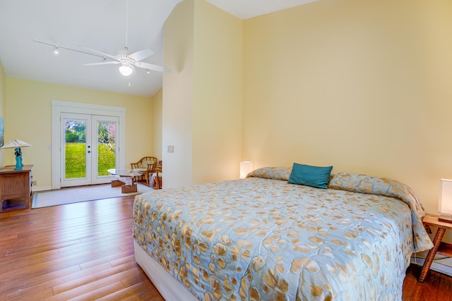 bedroom featuring french doors, access to outside, ceiling fan, and wood-type flooring