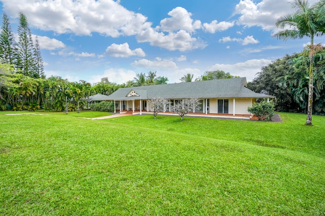 ranch-style house featuring a front yard