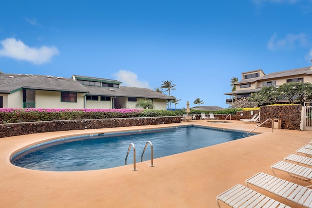 view of swimming pool featuring a patio area