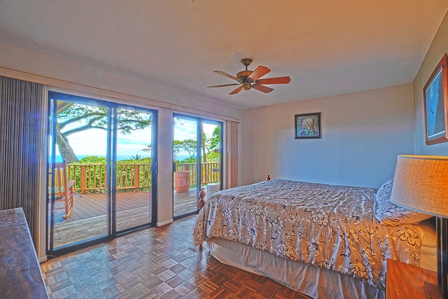 bedroom featuring dark parquet floors, access to outside, and ceiling fan