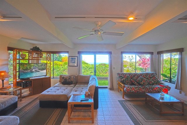 living room with tile patterned floors, beam ceiling, and ceiling fan