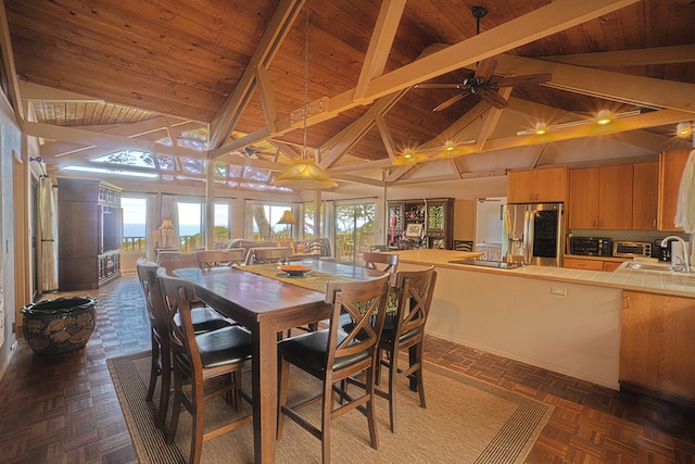 dining space with a wealth of natural light, dark parquet flooring, and wood ceiling