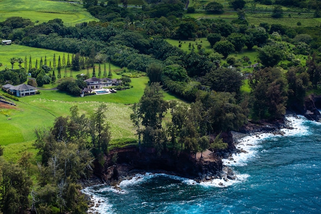 birds eye view of property featuring a rural view and a water view