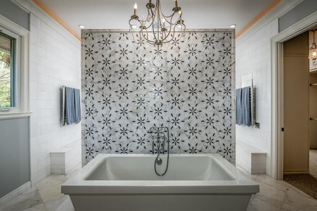 bathroom with tile patterned flooring, tile walls, a notable chandelier, and a bathing tub