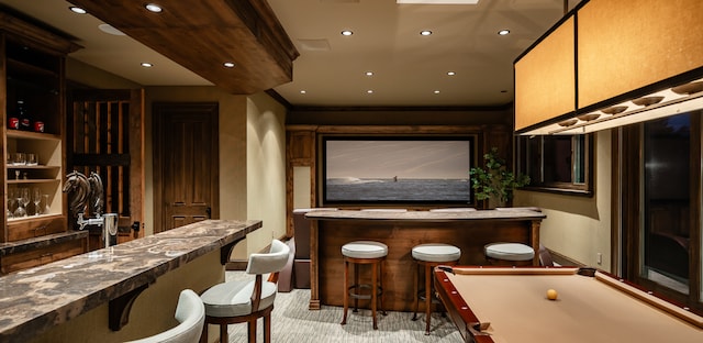 interior space with pool table, light colored carpet, and indoor bar