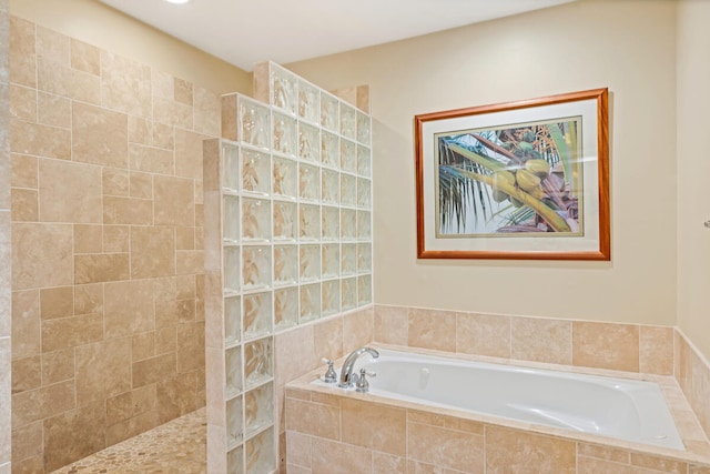 bathroom featuring separate shower and tub