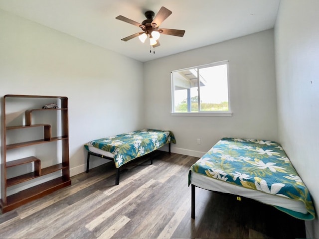 bedroom featuring ceiling fan and hardwood / wood-style flooring