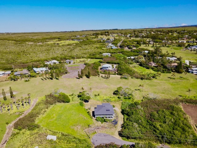 birds eye view of property with a rural view