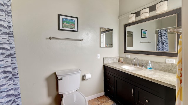 bathroom featuring tile patterned flooring, vanity, curtained shower, and toilet