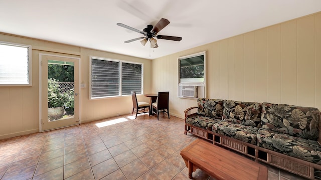 living room featuring ceiling fan, cooling unit, and light tile patterned flooring