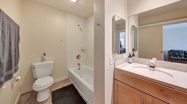 full bathroom featuring tile patterned flooring, vanity, toilet, and tiled shower / bath