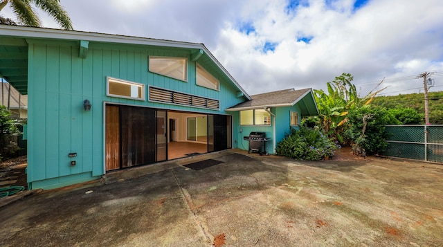 back of property featuring a patio