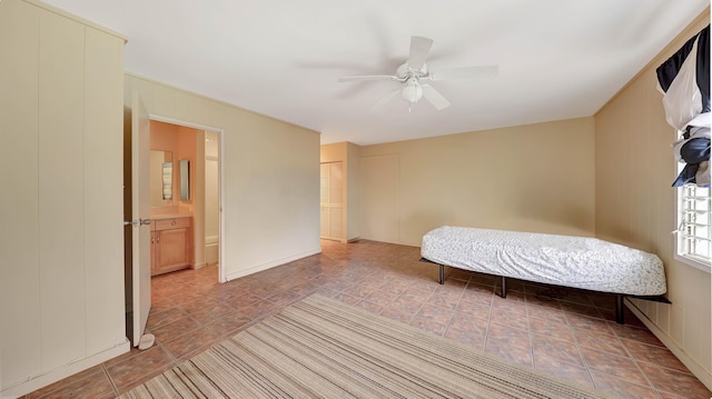 unfurnished bedroom with ensuite bath and ceiling fan