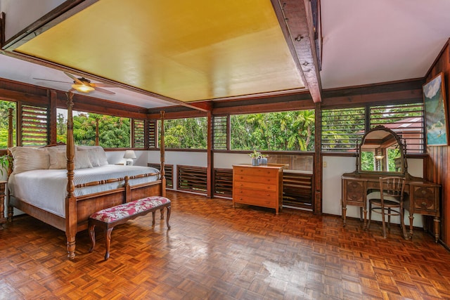 interior space with dark parquet flooring and multiple windows