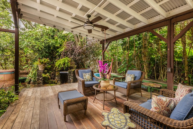 wooden terrace featuring an outdoor living space and ceiling fan